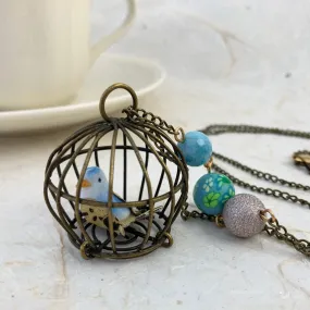 Little Bird In A Vintage Birdcage Pendant Necklace in Cornflower